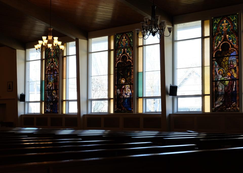 Light shines through windows onto the empty pews at St. Mary's Church in Washingtonville, New York, after the cancellation of Sunday Mass due to the new coronavirus. (AP Photo/Paul Kazdan)