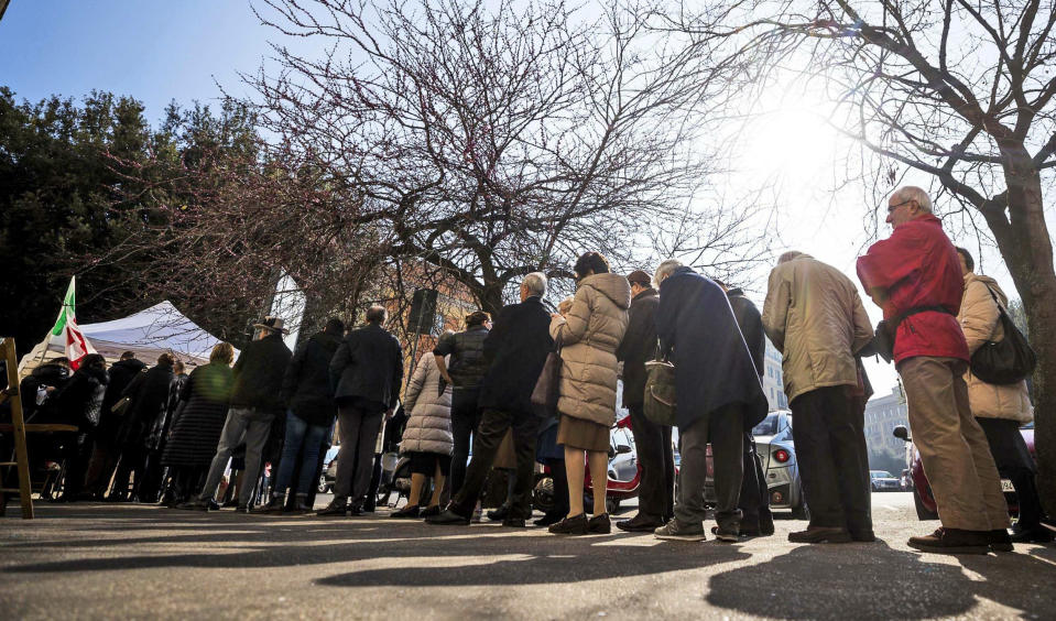 People line up to vote for a new Democratic Party secretary at a Democratic Party (PD) gazebo, in Rome, Sunday, March 3 2019. (Angelo Carconi/ANSA via AP)