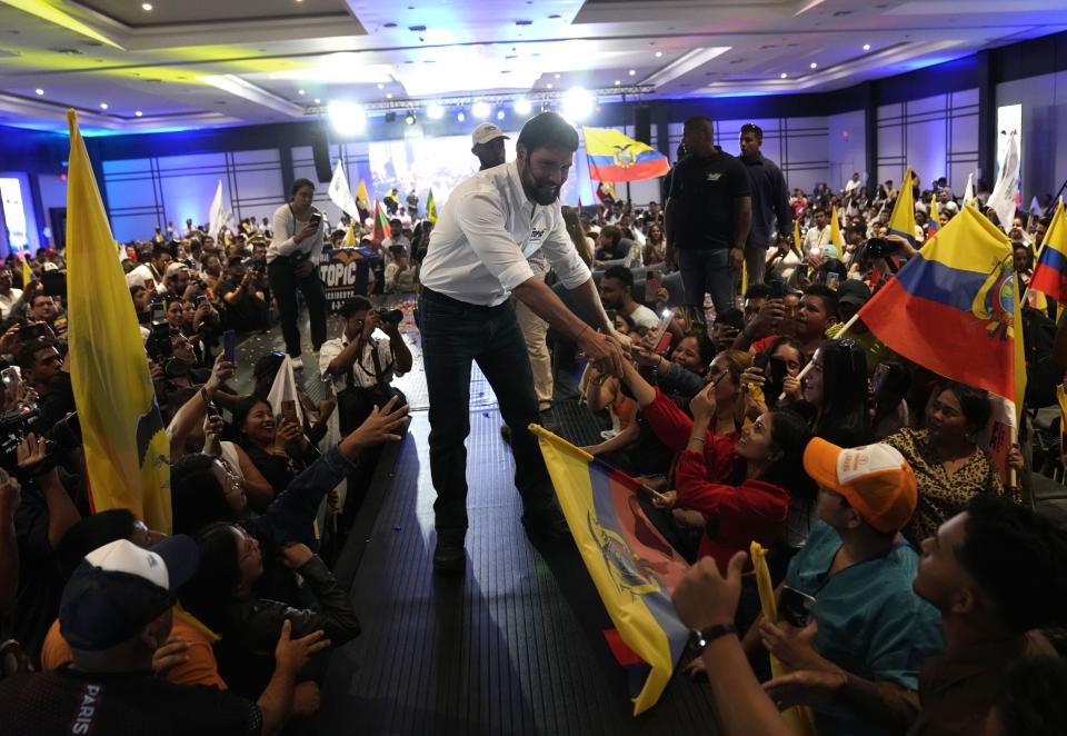 Jan Topic, presidential candidate for the Country Without Fear Coalition, greets supporters as he arrives at a campaign event ahead of snap elections set for Aug. 20, in Guayaquil, Ecuador, Thursday, Aug. 17, 2023. (AP Photo/Martin Mejia)