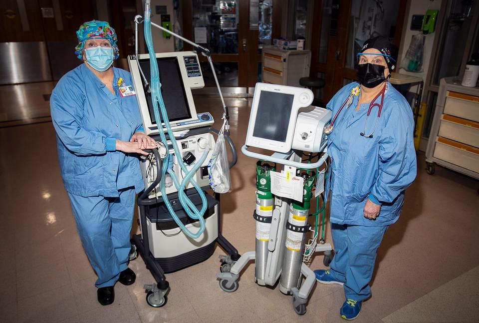 Good Samaritan Medical Center in Brockton Respiratory Therapists Debra Owen, 61, of Bridgewater, who has been with Good Samaritan for 40 years, and Kathleen Andrews, 64, of Easton, who has been at Good Samaritan for 41 years, pose with some of the ventilators they work with in the ICU on Thursday, March 11, 2021.