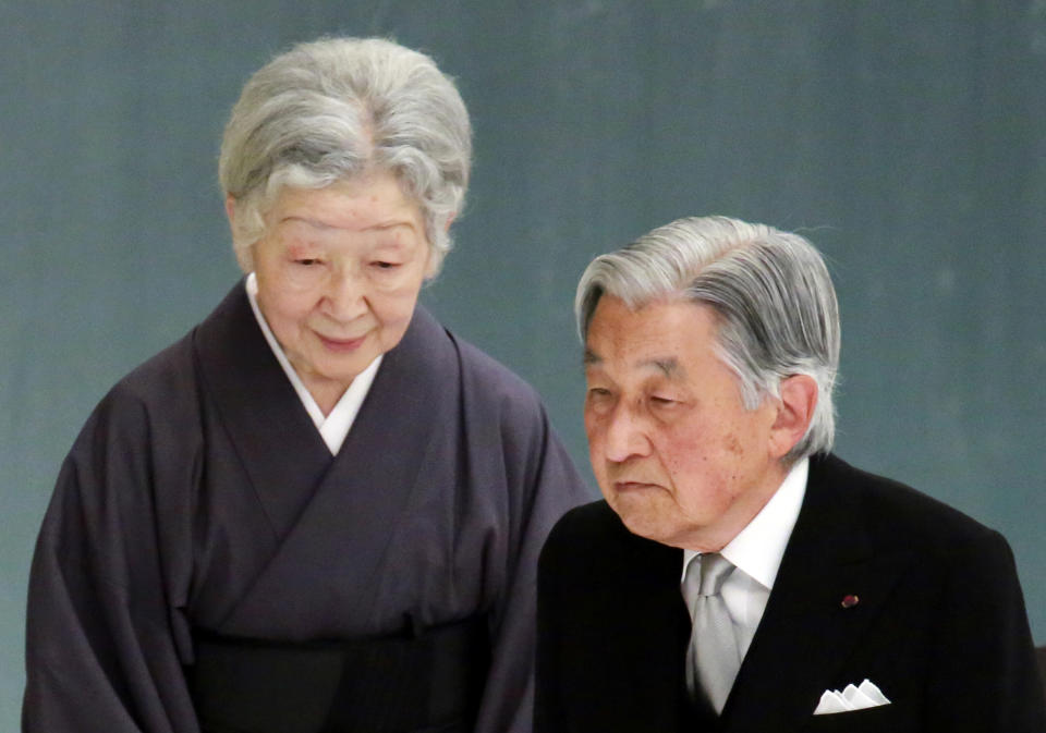 FILE - In this Aug. 15, 2018, file photo, Emperor Akihito, right, and Empress Michiko, attend a memorial service for the war dead at Nippon Budokan martial arts hall, in Tokyo. Japan's Emperor Akihito turns 85 on Sunday, Dec. 23, 2018, and will abdicate this spring. (AP Photo/Eugene Hoshiko, File)