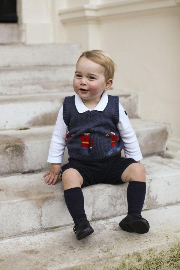 The rosy-cheeked prince could not have looked more adorable while sitting on the steps of Kensington Palace in his official 2014 Christmas portrait. (Photo: Twitter)