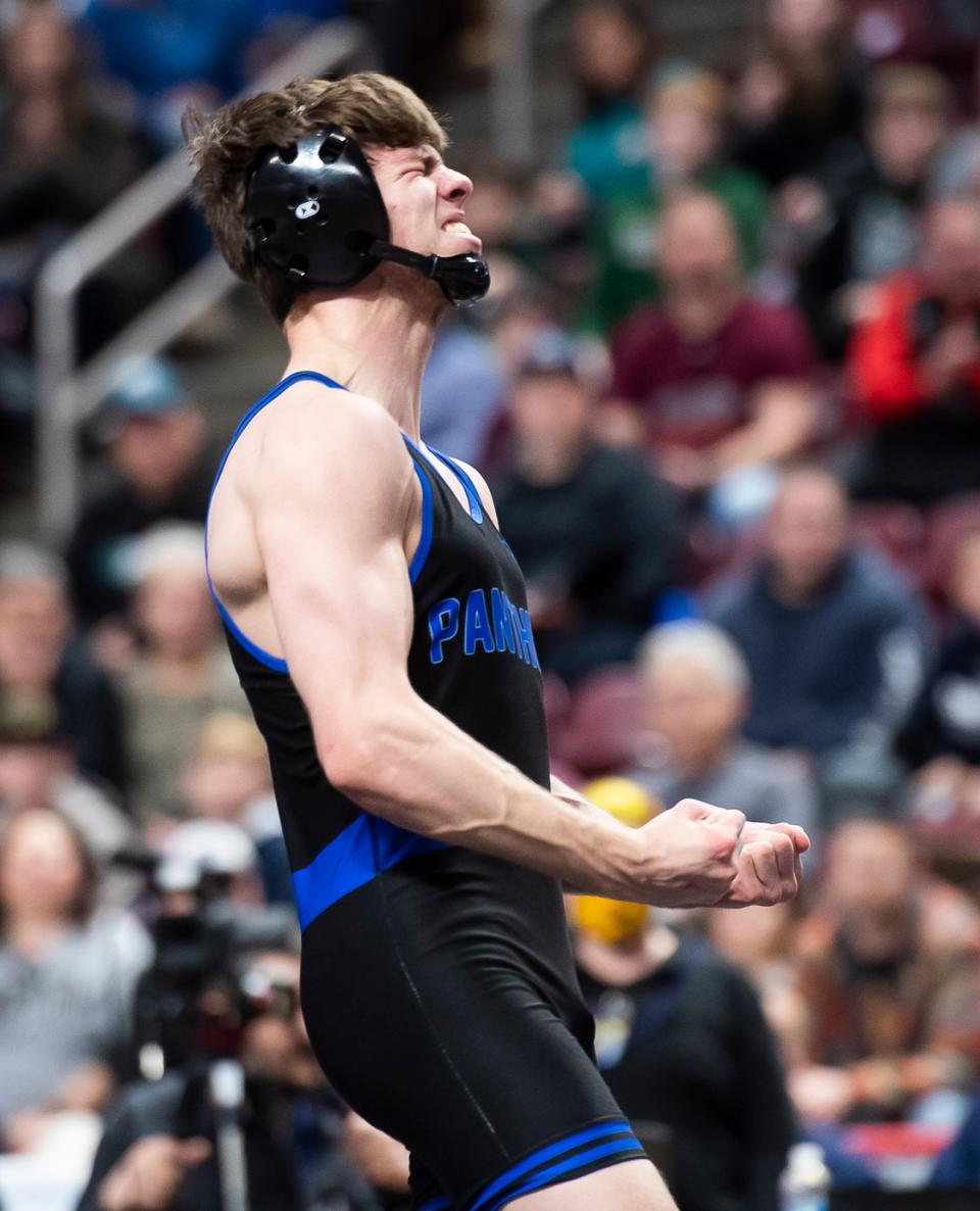 Quakertown's Collin Gaj celebrates after defeating Central Dauphin's Matt Repos in a 145-pound seminfinal bout at the PIAA Class 3A Wrestling Championships at the Giant Center on March 11, 2023, in Hershey. Gaj won by decision, 5-3. 