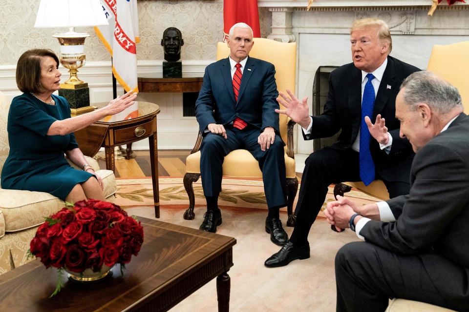 In this file photo taken on December 11, 2018, Vice President Mike Pence listens while Democratic incoming House Speaker Nancy Pelosi, President Donald Trump  and Democratic Senate Minority Leader Chuck Schumer argue about the impending government shutdown during a meeting at the White House in Washington, D.C.