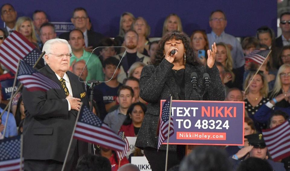 At left, John Hagee, senior pastor of Cornerstone Church in San Antonio, Texas, and founder of national advocacy group Christians United For Israel, stands by Candice Glover as she sings the national anthem at former 2024 presidential hopeful Nikki Haley's campaign launch in Charleston, S.C., in February 2023.