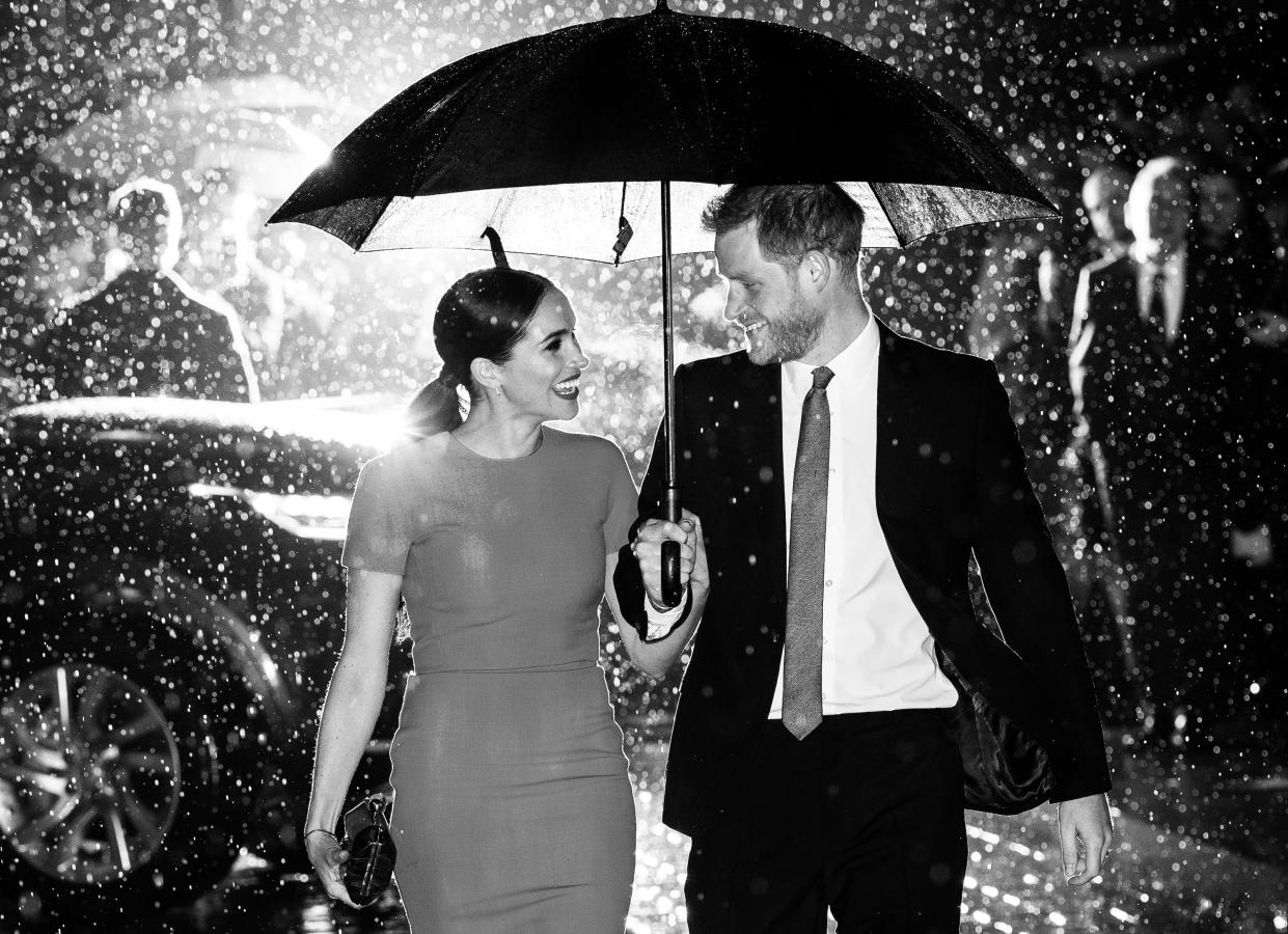 Harry and Meghan get caught in the rain at the Endeavour Fund Awards – one of their last engagements as working royals. (Getty Images)