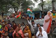 People, who claim to have migrated from Pakistan's Sindh Province, cheer as they celebrate after India's parliament passed a Citizenship Amendment Bill, at Majnu Ka Tila in New Delhi