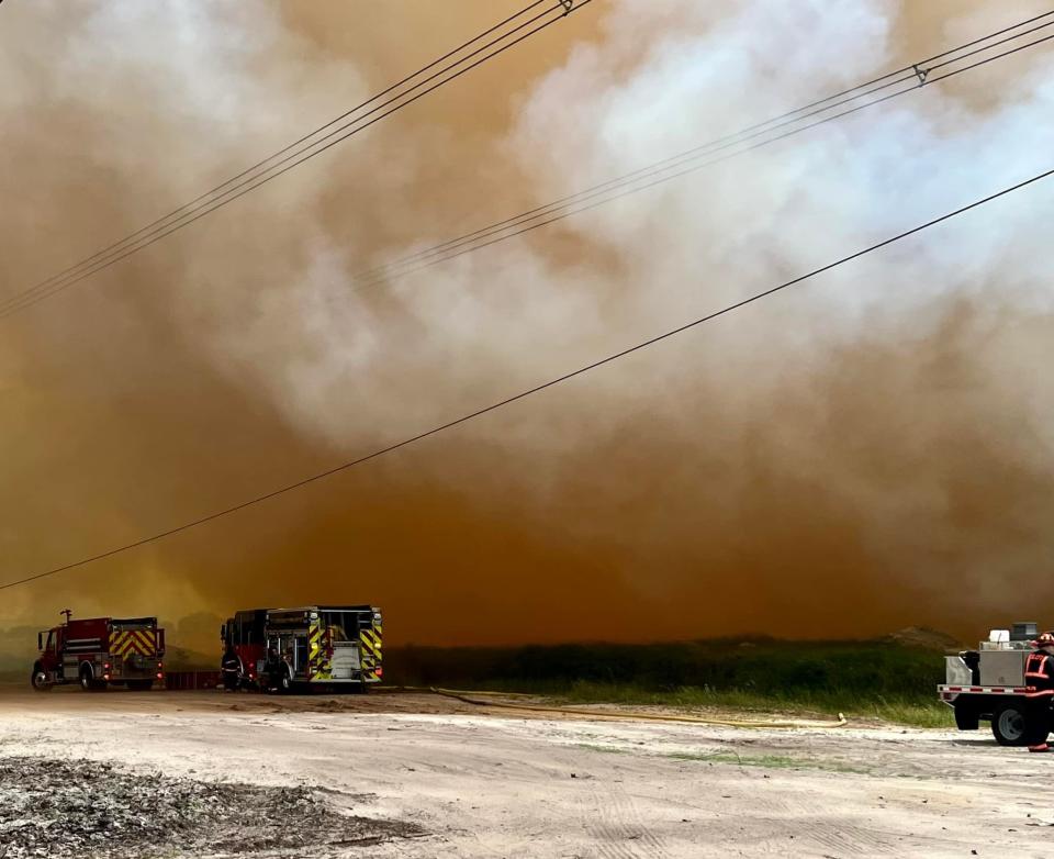 St. Lucie County Fire District and Florida Forest Service officials on Aug. 25, 2022, respond to a mulch fire in the area of Glades Cut Off and Range Line roads.