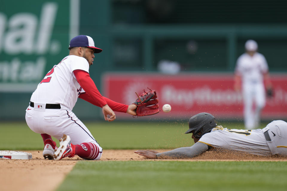 Washington Nationals second baseman Luis Garcia, left, prepares to tag out Pittsburgh Pirates' Ke'Bryan Hayes as Hayes is caught stealing second base in the fifth inning of the first baseball game of a doubleheader, Saturday, April 29, 2023, in Washington. (AP Photo/Patrick Semansky)