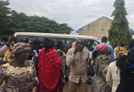 Parents wait to be reunited with released students of the Bethel Baptist High School in Damishi, Nigeria, on Sunday, July 25, 2021. Armed kidnappers in Nigeria have released 28 of the more than 120 students who were abducted at the beginning of July from the Bethel Baptist High School in the northern town of Damishi. Church officials handed those children over to their parents at the school on Sunday. (AP Photo)