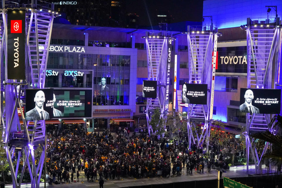 LOS ANGELES, CALIFORNIA - JANUARY 26: Los Angeles Lakers fans gather to mourn the death of retired NBA star Kobe Bryant at Xbox Plaza on January 26, 2020 in Los Angeles, California. Bryant, 41, died today in a helicopter crash in near Calabasas, California. (Photo by Rachel Luna/Getty Images)