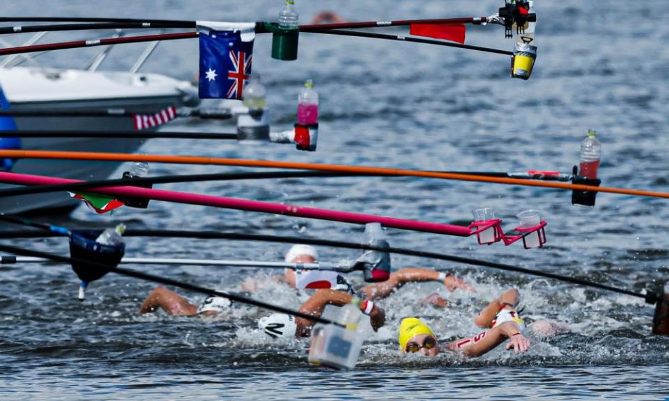 Kareena Lee of Australia stops at the feeding pontoon during the open water swim