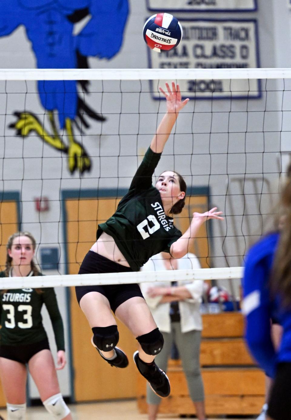 Brodie Gerlach of Sturgis West hits the ball over the net against Mashpee.