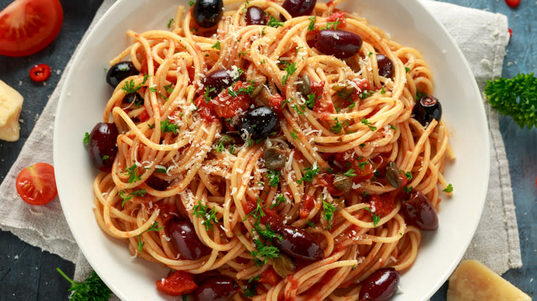 bowl of pasta with tomatoes and olives