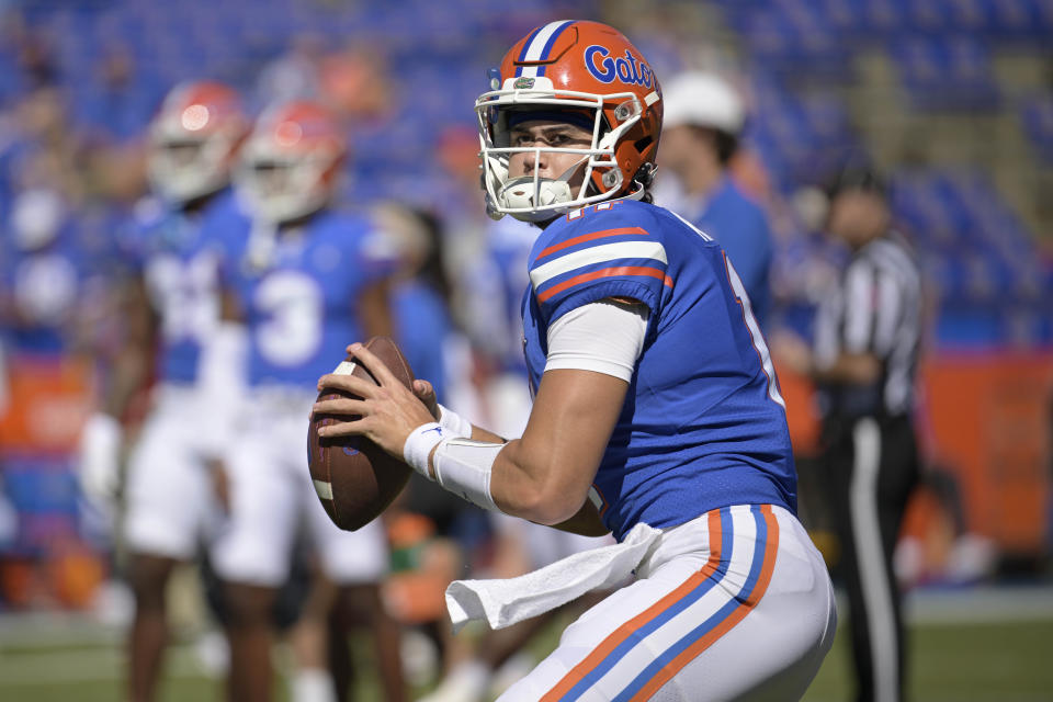 FILE - Florida quarterback Jalen Kitna (11) warms up before an NCAA college football game against Eastern Washington, Sunday, Oct. 2, 2022, in Gainesville, Fla. Ex-Florida quarterback Jalen Kitna, the son of retired NFL quarterback Jon Kitna, accepted a plea deal Wednesday, July 5, 2023, that dismissed five felony child pornography charges stemming from his arrest last November. (AP Photo/Phelan M. Ebenhack, File)