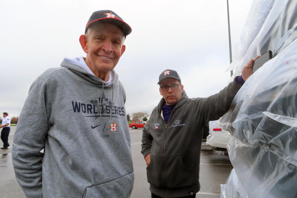 Jim "Mattress Mack" McIngvale, of Houston, left, stands near a stack of mattresses he was giving away in Atlantic City N.J., Tuesday, Nov. 1, 2022. A prolific gambler with a knack for attention-getting bets stands to win nearly $75 million if the Houston Astros win the World Series, including what sports books say would be the largest payout on a single legal sports bet in U.S. history. McIngvale has wagered a total of $10 million with numerous sports books on an Astros victory.(AP Photo/Wayne Parry)