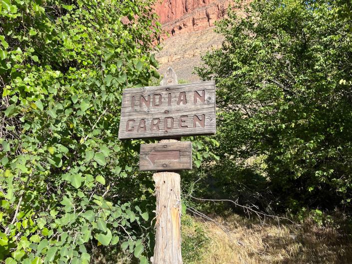 A wooden sign saying Indian Garden.