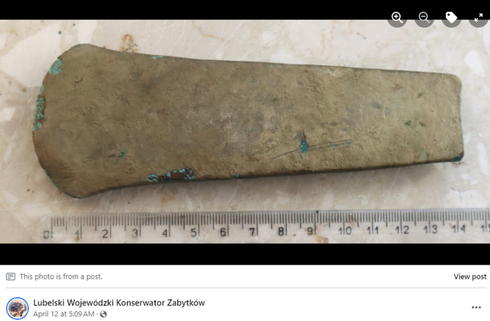 The ax, about 6 inches long, was imported to the region in the early Neolithic period, officials said. Screengrab from Lubelski Wojewódzki Konserwator Zabytków's Facebook post
