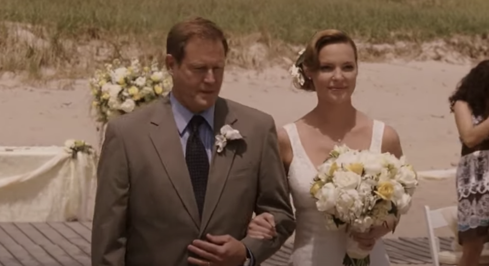 A father walking his daughter down the aisle.