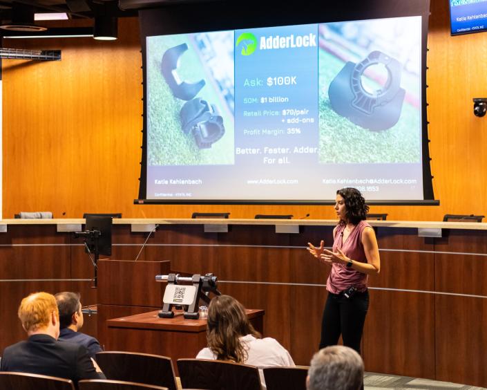 Katie Kehlenbach explains her business plan to the judges of the Round Rock Public Library&#39;s business plan competition.