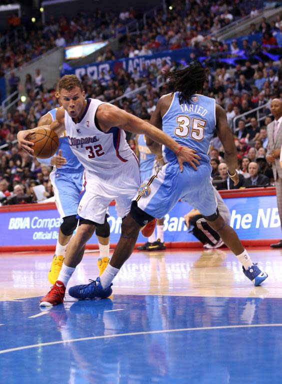 Blake Griffin of the Los Angeles Clippers is fouled as he drives against Denver Nuggets' Kenneth Faried at Staples Center on April 15, 2014