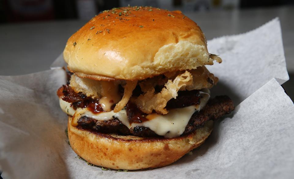 The Slab Burger is one of the menu items at Slab Kitchen, which is open 4 to 9 p.m. Tuesday-Friday, noon to 9 p.m. Saturday and noon to 7 p.m. Sunday.