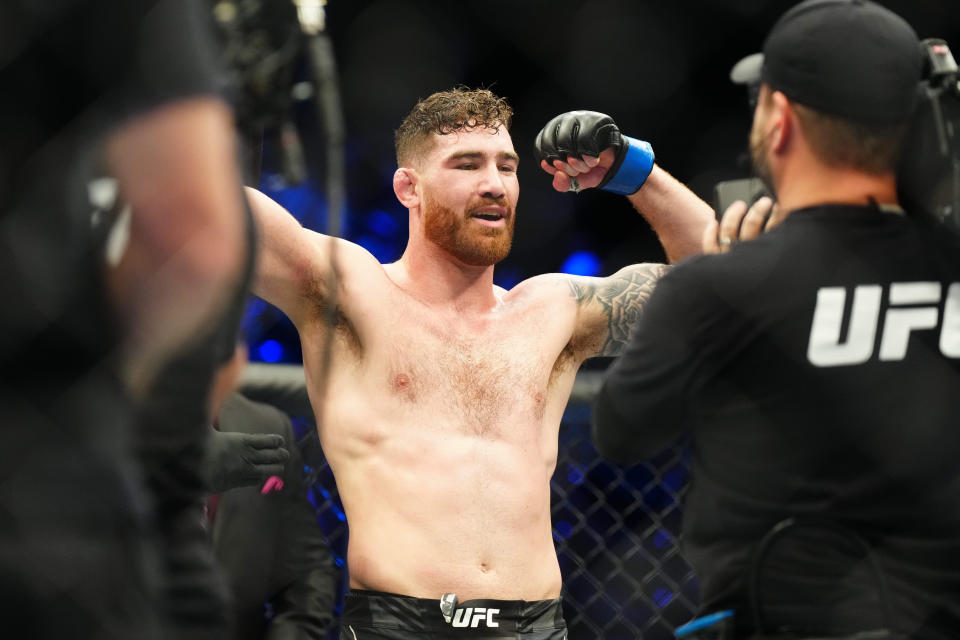 Mar 11, 2023; Las Vegas, Nevada, USA; Josh Fremd (blue gloves) reacts after fighting Sedriques Dumas (red gloves) during UFC Fight Night at Virgin Hotel. Mandatory Credit: Ron Chenoy-USA TODAY Sports