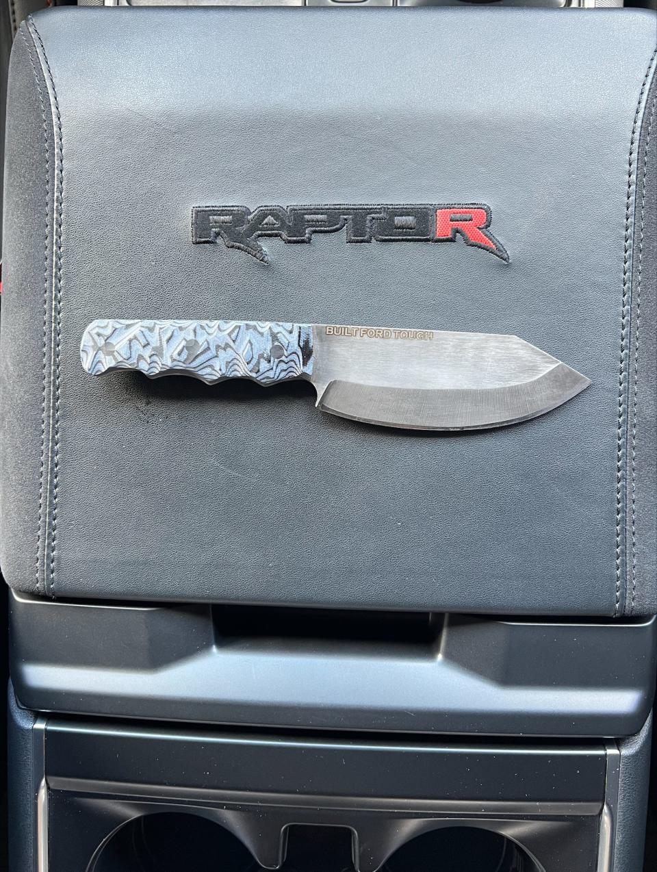 Ret. U.S. Marine Sgt. Tyler Vargas Andrews left the military after losing an arm and a leg in a suicide bomb attack in Kabul, Afghanistan in 2023. He now creates custom knives like the one pictured here on the console of his new 2024 Ford F-150 Raptor R.