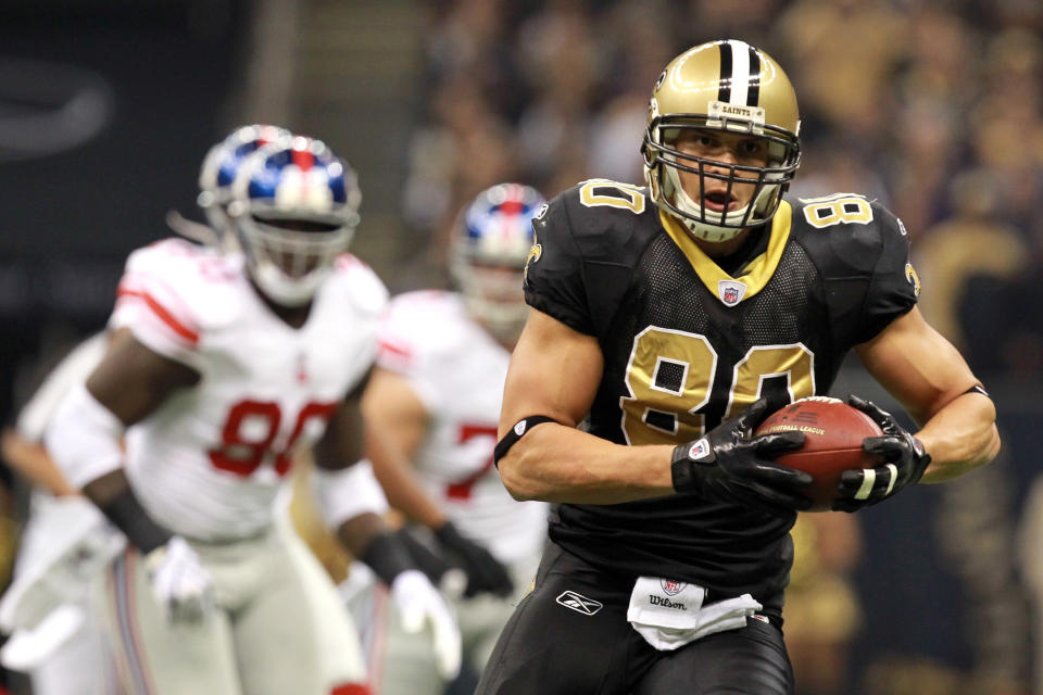 NEW ORLEANS, LA - NOVEMBER 28: Tight end Jimmy Graham #80 of the New Orleans Saints runs after a first quarter catch ahead of Jason Pierre-Paul #90 of the New York Giants at Mercedes-Benz Superdome on November 28, 2011 in New Orleans, Louisiana. (Photo by Ronald Martinez/Getty Images)
