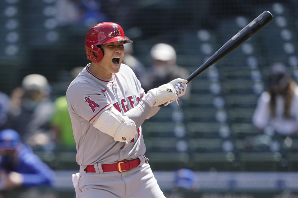 Los Angeles Angels' Shohei Ohtani reacts after being hit by a pitch during the first inning of a baseball game against the Seattle Mariners, Sunday, May 2, 2021, in Seattle. (AP Photo/Ted S. Warren)