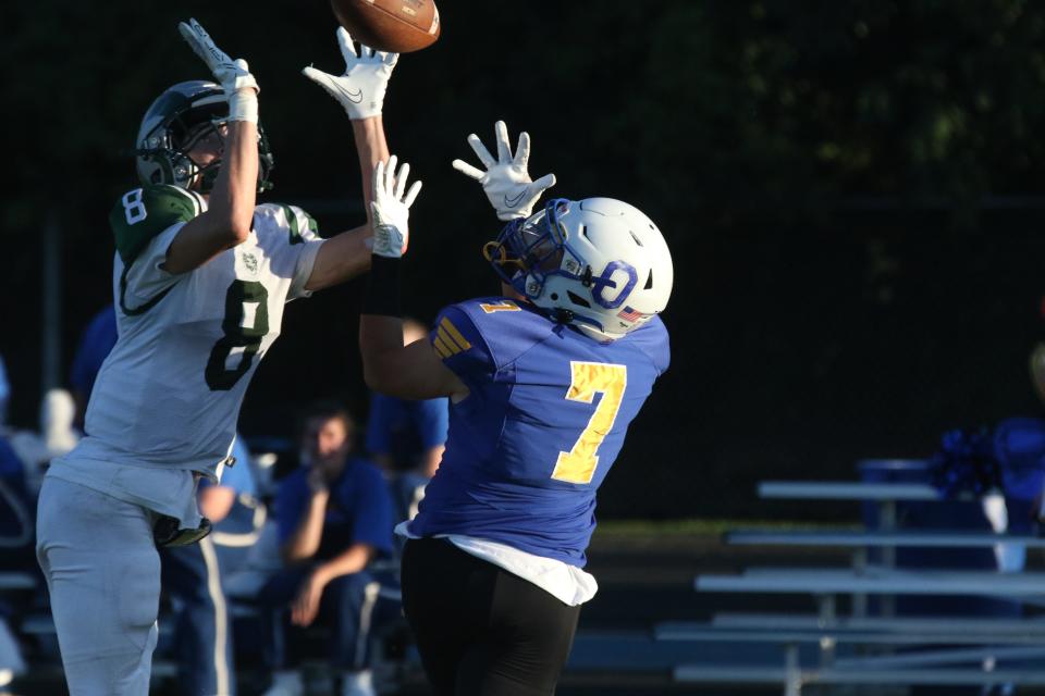 Ontario's Peyton Dzugan hauls in a touchdown pass in the corner of the end zone during the Warriors' 38-0 win over Madison on Friday night.