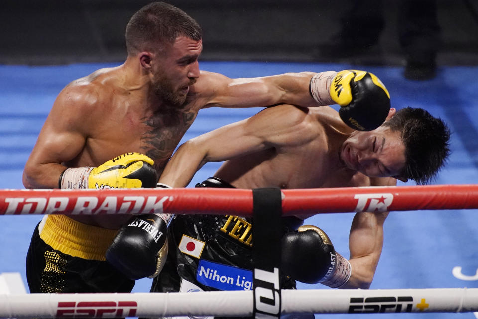 Vasiliy Lomachenko, of Ukraine, lands a left to Masayoshi Nakatani, of Japan, during a lightweight bout Saturday, June 26, 2021, in Las Vegas. (AP Photo/John Locher)