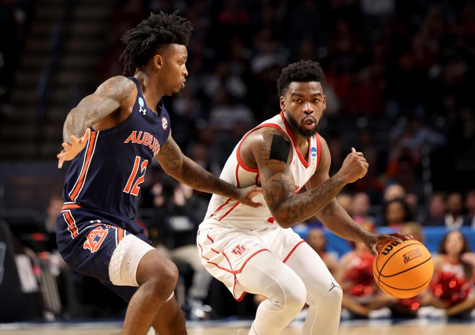 Mar 18, 2023; Birmingham, AL, USA; Houston Cougars guard Jamal Shead (1) dribbles against Auburn Tigers guard Zep Jasper (12) during the first half at Legacy Arena.