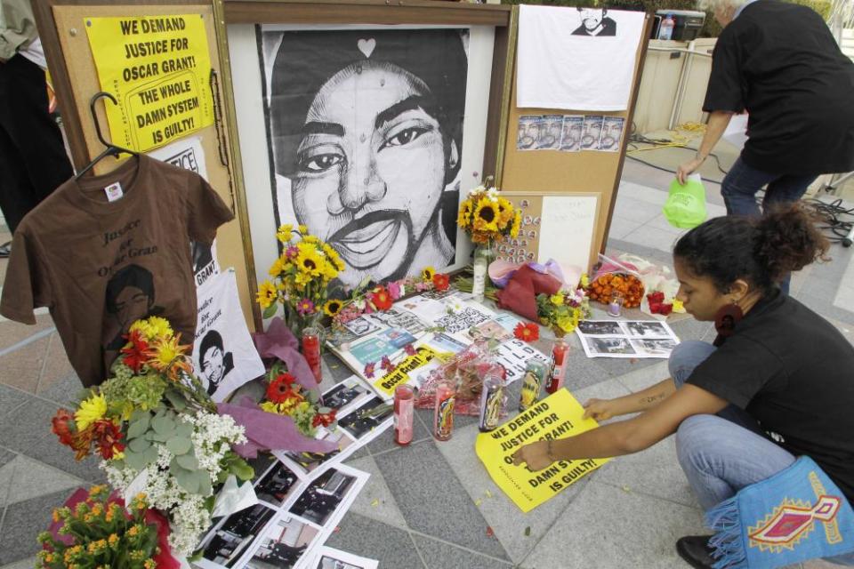 People leaves messages at a memorial to Oscar Grant in Oakland, California on 5 October 2010.