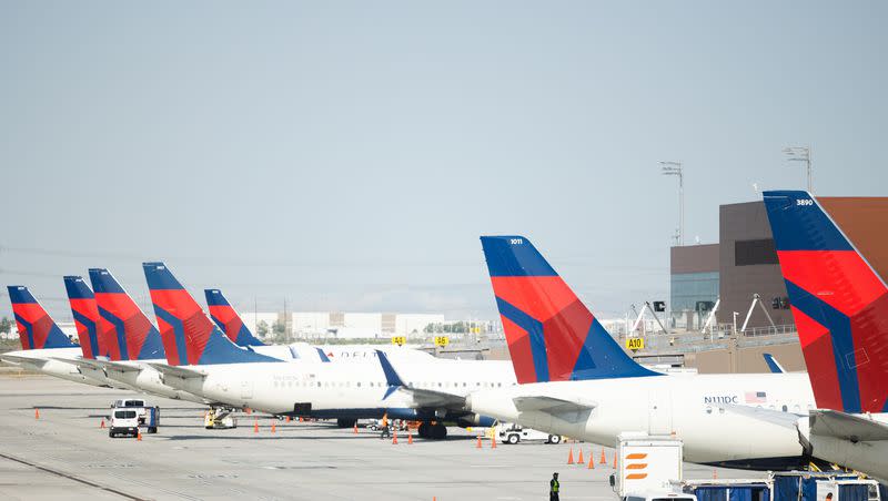 Delta Air Lines planes wait on the tarmac at the Salt Lake City International Airport in Salt Lake City on Friday, May 19, 2023.