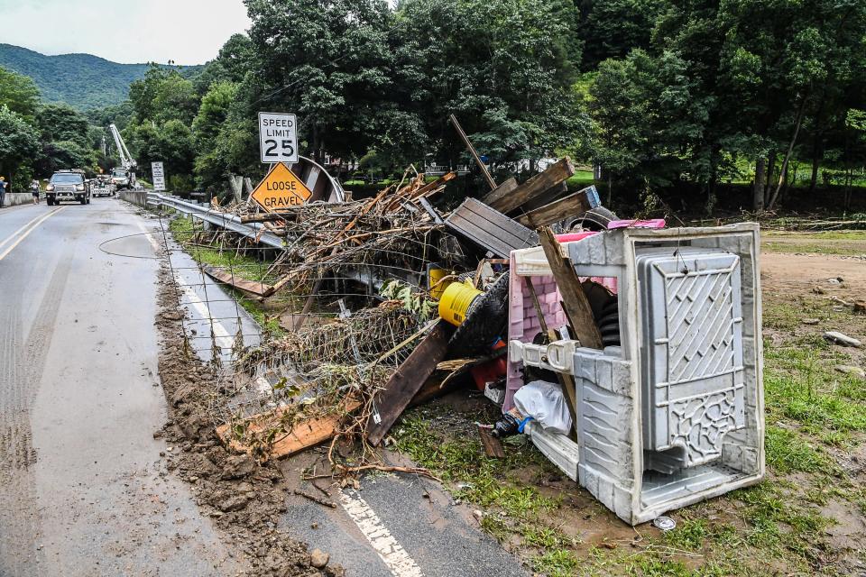 Wreckage from homes in Cruso washed up along the roadways on Thursday, August 19, 2021.