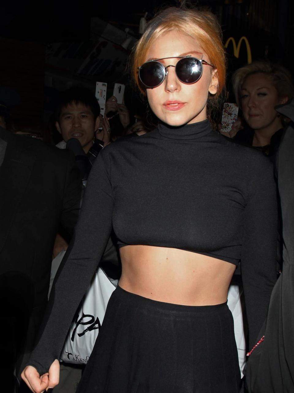 <p>Lady Gaga is spotted wearing a simple black cropped top and skirt with a pair of round frame sunglasses, from Thom Browne's first eyewear collection which is under a licensee agreement with DITA eyewear whilst out and about in Tokyo, May 2012.</p>