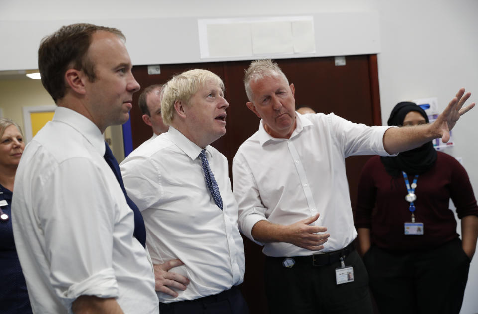 Prime Minister Boris Johnson (2nd left) and Matt Hancock, Secretary of State for Health and Social Care (left) during a visit to Pilgrim Hospital in Boston, Lincolnshire, to announce the government's NHS spending pledge of 1.8 billion.