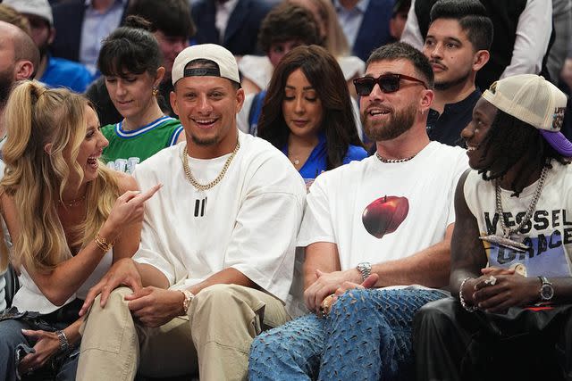 <p>Glenn James/NBAE via Getty</p> Kelce and the Mahomes sat courtside at the NBA playoffs game in Dallas on May 26