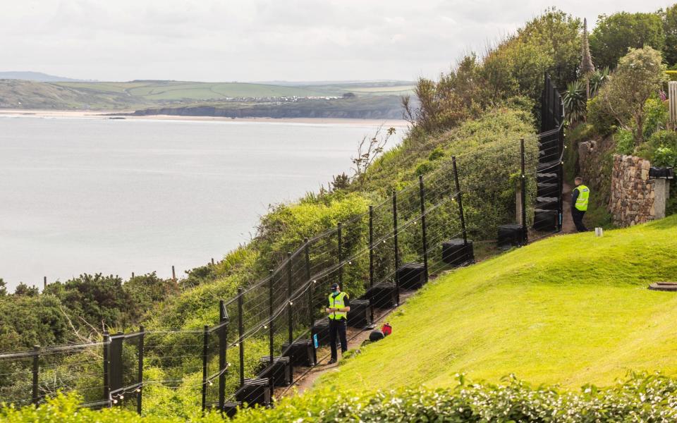 Police and security teams keep a heavy presence in Carbis Bay, Cornwall, - SWNS