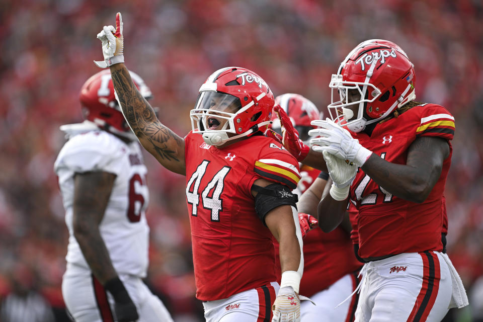 Maryland linebacker Caleb Wheatland (44) celebrates his sack of Indiana quarterback Tayven Jackson during the first half of an NCAA college football game, Saturday, Sept. 30, 2023, in College Park, Md. (AP Photo/Terrance Williams)