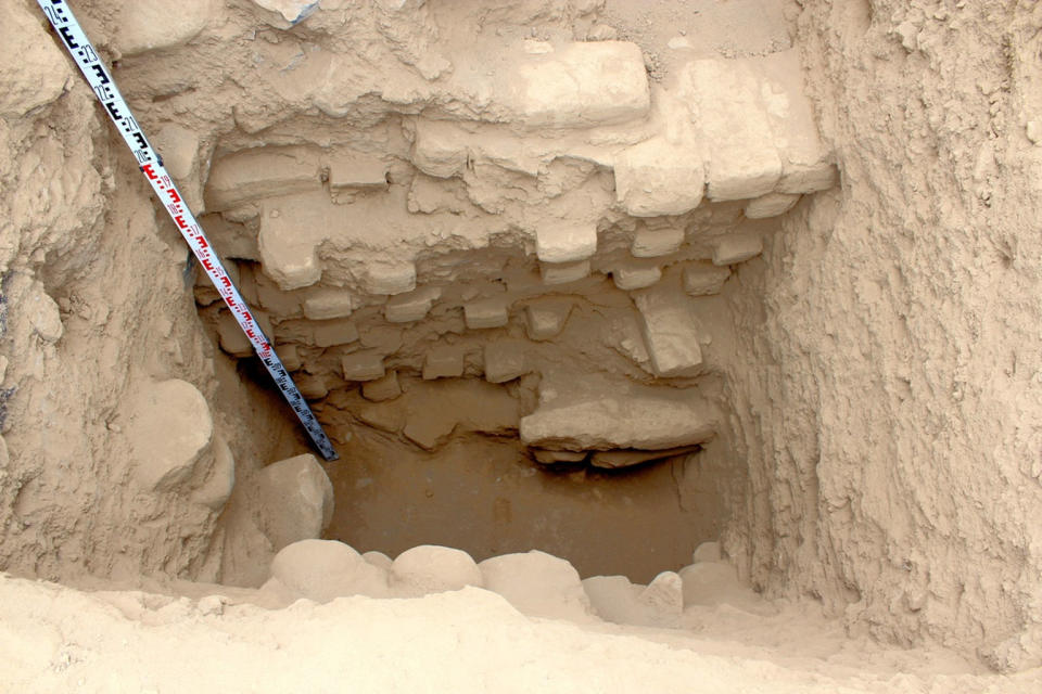 Archaeologists dug a trench into the inner crater of the volcano-shaped mound, finding a collapsed stairwell that descended to a mud-plaster floor. <cite>Courtesy of Robert Benfer</cite>