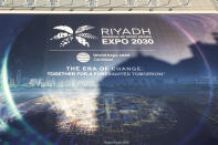 FILE - A canvas decorated with a commercial for the Riyadh Expo 2030 protects a building under renovation, Tuesday, Nov. 28, 2023 in Paris. Saudi Arabia's capital Riyadh was chosen on Tuesday to host the 2030 World Expo, beating out South Korean port city Busan and Rome for an event expected to draw millions of visitors. (AP Photo/Thomas Padilla, File)