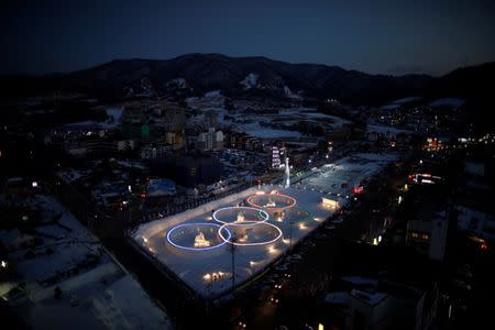 An ice sculpture of the Olympic rings is illuminated during the Pyeongchang Winter Festival, near the venue for the opening and closing ceremony of the PyeongChang 2018 Winter Olympic Games in Pyeongchang, South Korea, February 10, 2017. REUTERS/Kim Hong-Ji