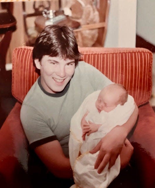 Stephen Flynn holding his goddaughter. Flynn, 57, was shot and killed March 30, 2023 in the 1400 block of Priscilla Avenue on the east side of Indianapolis. His family said he was delivering pizza to a vacant home.