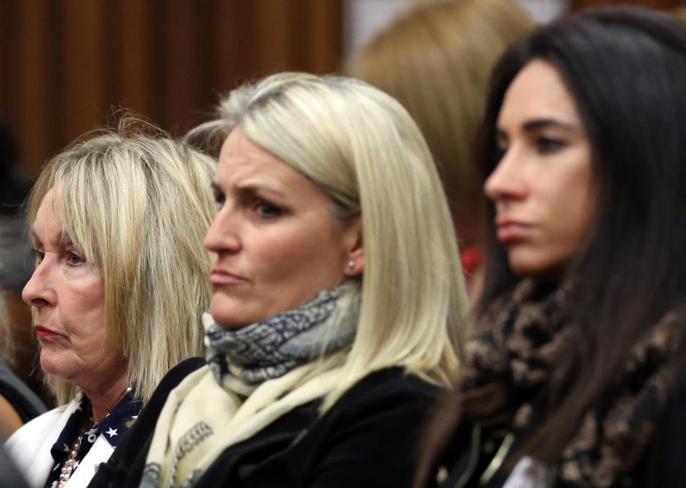 June Steenkamp, left, mother of the late Reeva Steenkamp, listens in the public gallery, as state prosecutor Gerrie Nel questions Oscar Pistorius, in court in Pretoria, South Africa, Friday, April 11, 2014. Pistorius is charged with the murder of his girlfriend Steenkamp, on Valentines Day in 2013. (AP Photo/Themba Hadebe, Pool)