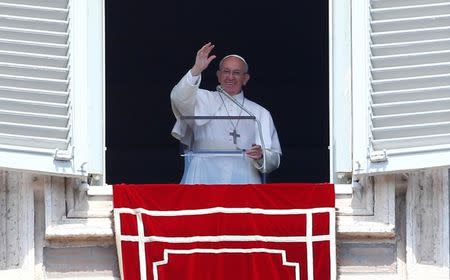 Pope Francis waves as he leads the Angelus prayer in Saint Peter's Square at the Vatican April 23, 2017. REUTERS/Tony Gentile