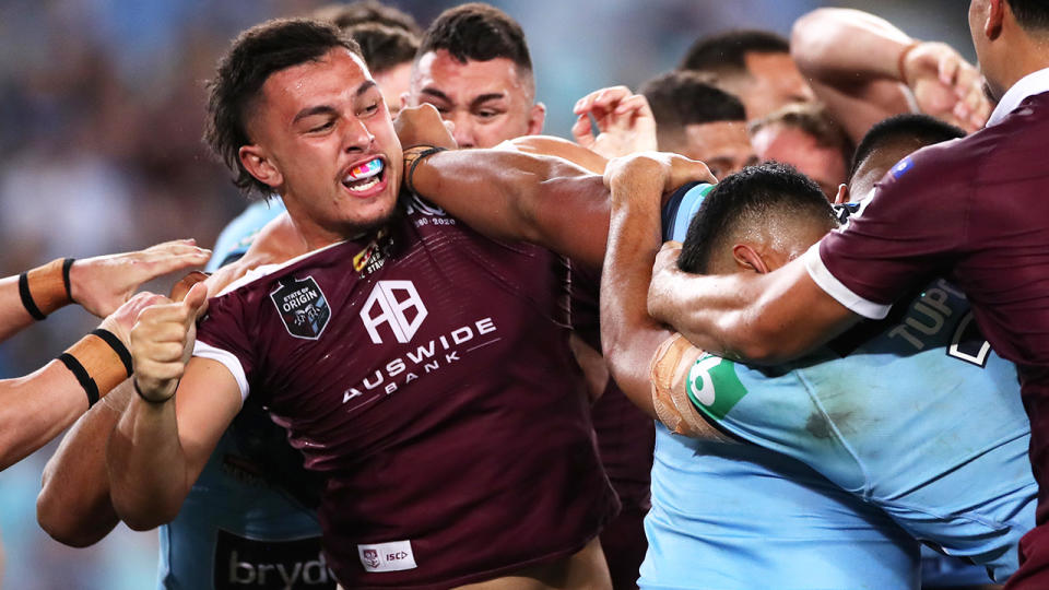 Tino Fa'asuamaleaui and Payne Haas, pictured here punching on during State of Origin II.