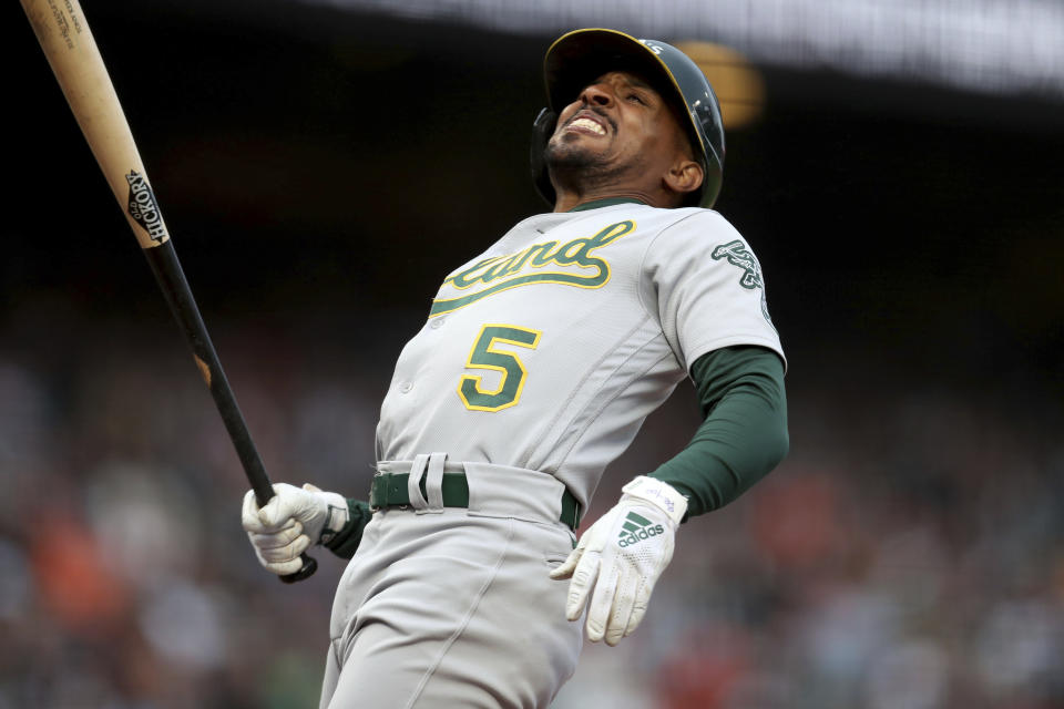 Oakland Athletics' Tony Kemp is hit by a pitch against the San Francisco Giants during the third inning of a baseball game in San Francisco, Friday, June 25, 2021. (AP Photo/Jed Jacobsohn)