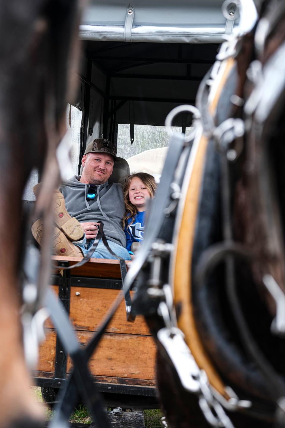 David and Levi Jones get ready to head back on the road as they finish taking a break on Stephenson Road in Maury County on April 3.